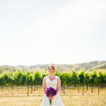 Bride with Purple Floral Arrangement